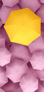 Yellow umbrella among pastel pink umbrellas wallpaper.