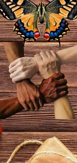 Hands of diverse skin tones interlocked with a butterfly on a rustic background.