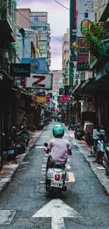 Urban alley with scooter rider on street.