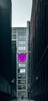 Urban alley with a purple emoticon on a high-rise building façade.