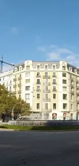 Urban landscape with a stylish building and blue sky.