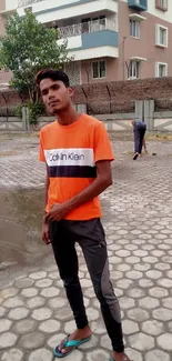 Person in urban setting wearing casual clothes.