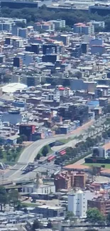 Aerial view of a vibrant cityscape, showcasing urban architecture and bustling streets.