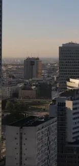 Urban cityscape with modern buildings at sunset.