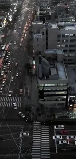 A vibrant urban evening cityscape shot from above.