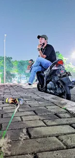 Urban evening scene with motorbike and thoughtful person.