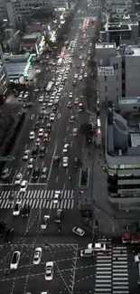 A bustling city street with evening traffic and lights.