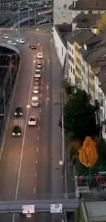 A busy urban street at evening with cars and architecture.