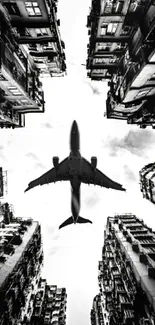 Black and white cityscape with a plane overhead.