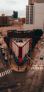 Aerial view of city intersection with buildings and streets.