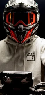 Biker in helmet and hoodie for an urban adventure wallpaper.