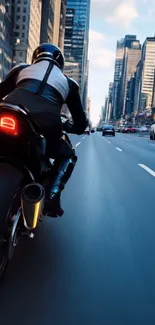 Motorcycle rider on city street at high speed.