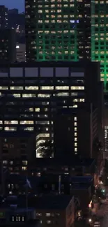 Night cityscape wallpaper with glowing illuminated skyscrapers.