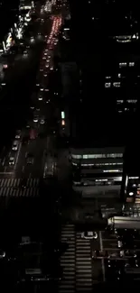 Dark cityscape view with illuminated streets at night.