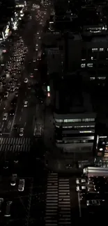 A vibrant urban night cityscape with busy traffic and illuminated buildings.