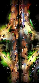 Aerial view of illuminated city crossroad at night with vibrant lights