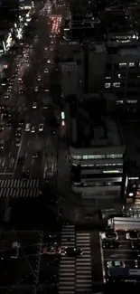 A bustling city street at night with vibrant lights and traffic.