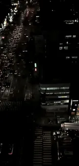 Night view of busy city traffic with urban buildings.