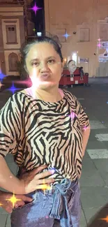 Woman in zebra print shirt at night city scene.