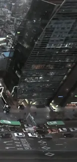 Aerial view of a cityscape at night with bright lights.