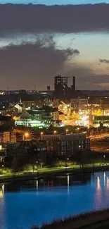 A city skyline glowing with lights against a deep blue night sky.