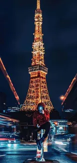 Urban night scene with glowing tower and moving lights.