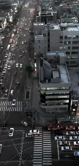 Night aerial view of urban city street with traffic and lights.