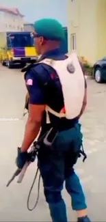 A patrol officer with green beret in urban setting, viewed from behind.