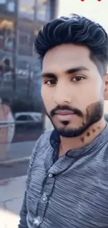 Young man posing in urban setting.