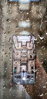 Raindrops on window with cityscape phone view.