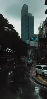 Rainy city street with skyscraper and moody atmosphere.