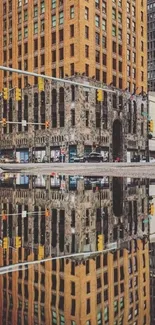 Urban skyscraper reflected in water with vibrant city colors.