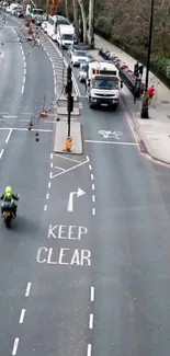 Motorbike on urban road with traffic and street signs in city setting