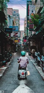 Scooter rider navigating a vibrant urban street.