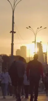 Silhouetted figures walking under a sunset in the city.