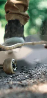 Skateboarder in motion on rough road in urban setting.