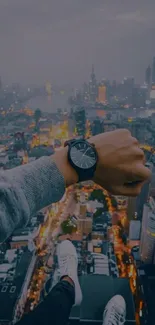 Forefront wristwatch overlooking urban skyline from above.