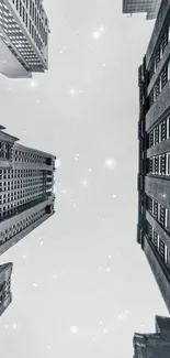 Skyward view of urban skyscrapers against a gray sky.