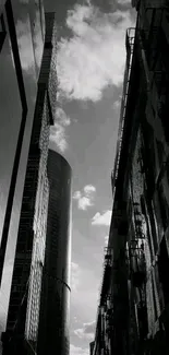 Monochrome skyline with skyscrapers and clouds.