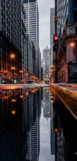 Urban cityscape skyline reflected in water at night.