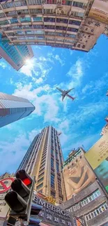 Skyscraper and aircraft against a blue sky in an urban setting.