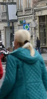 Vibrant urban street crossing with pedestrians and traffic.