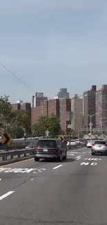 City street view with cars and buildings, perfect for urban-themed mobile wallpapers.