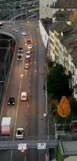 Urban street with evening traffic by railway crossing.