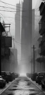 Moody urban street scene with towering skyscrapers in grayscale.