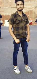 Young man in urban style outfit with casual shoes.