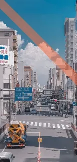 Urban street view with orange accent and city buildings under a blue sky.