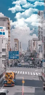 Urban street view with blue sky and city buildings.