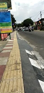 Urban street view with pathway and road signs.