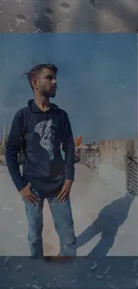 Urban rooftop portrait with blue sky.